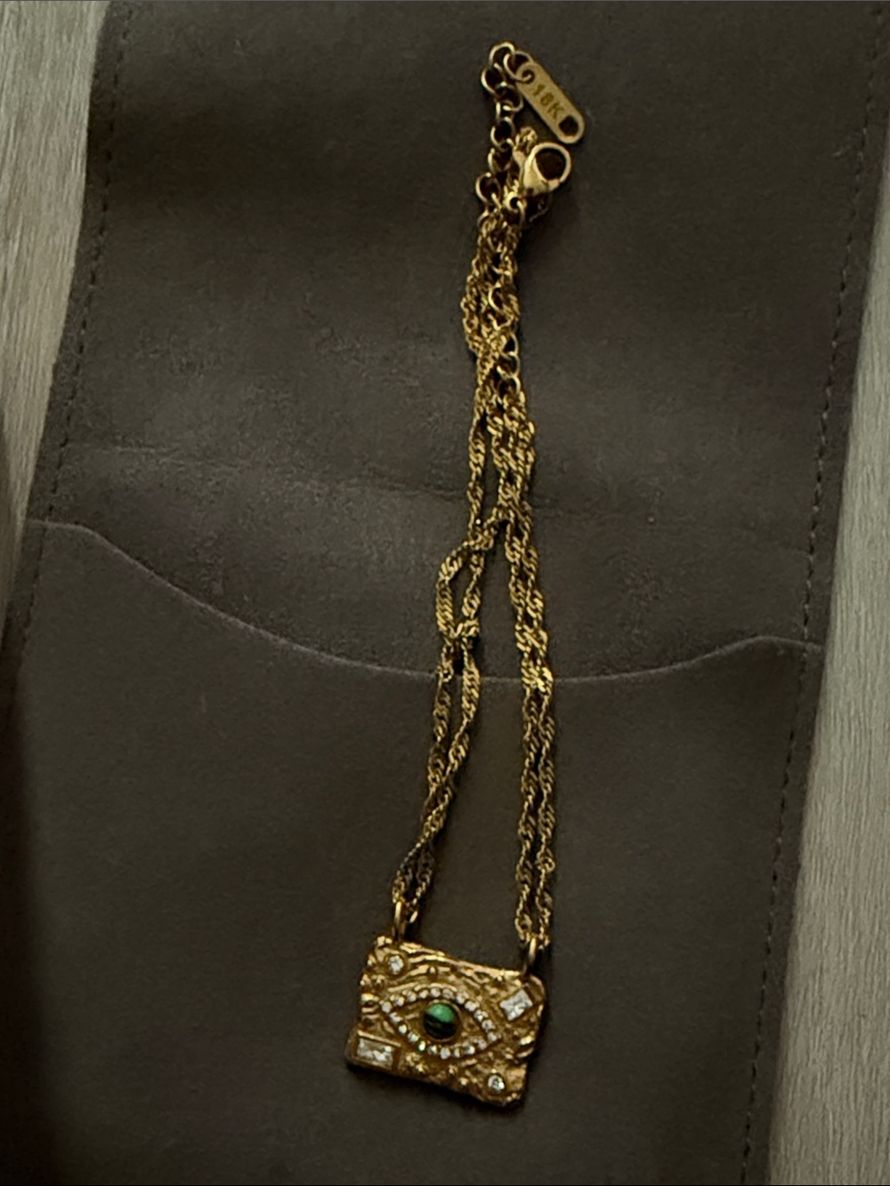 Gold-Tone Eye Pendant Necklace with Green Cabochon